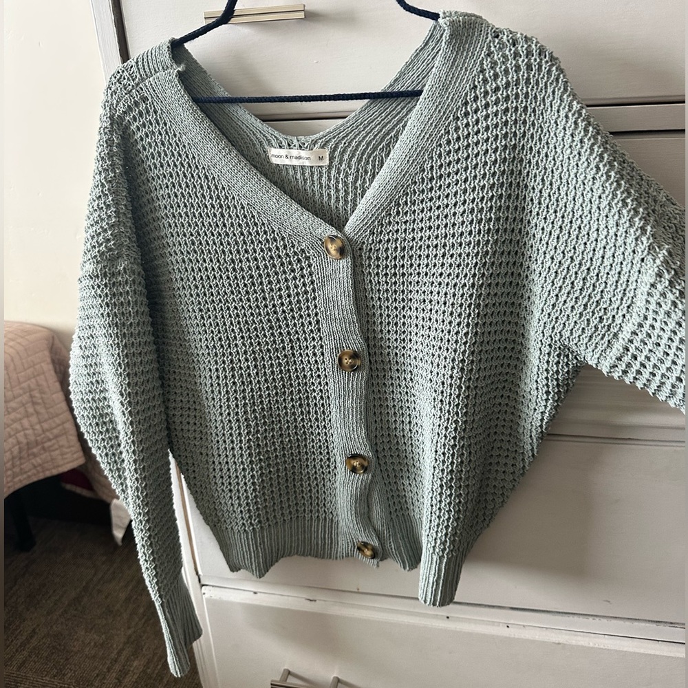 green pastel sweater